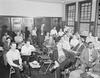 Group of men at meeting in schoolhouse. Group of men at meeting in schoolhouse.